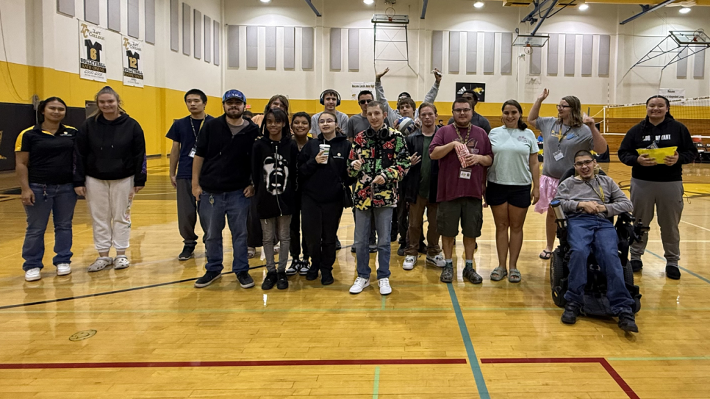 Members of TC staff and TIL students in the gym at the college featured for community connections night.